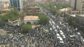 Thousands line the streets of Khartoum on day of al-Bashir's arrest