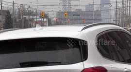 Pedestrians and vehicles navigate road construction maze in Markham near Toronto as the spring road work season begins in Canada