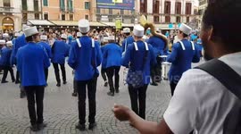 Youth orchestra performing across a street at Verona, Italy