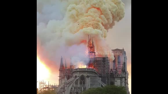 Moment Notre Dame's spire collapses during massive fire