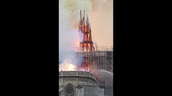 FRANCE NOTRE-DAME: Moment spire collapses during massive inferno