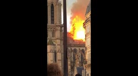 Roof of Notre Dame covered in flames