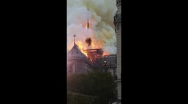 Close up of Notre Dame spire in flames