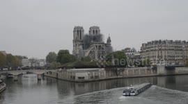 Media and tourists gather at Notre Dame on morning after fire