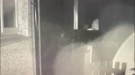 Terrifying moment masked gang member attacks dad outside own home with machete