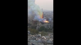 Notre dame in fire from the top floor of Sorbonne university