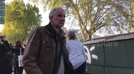 Crowd staring at the Notre Dame Cathedral two days after the fire