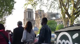 Street Crowd staring at the Notre Dame Cathedral two days after the fire