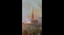 Horrified crowds watch as Notre Dame's spire collapses