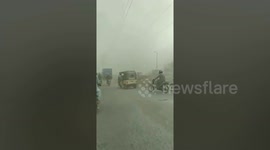 Motorcyclist Rides Through Dust Storm In Pakistan