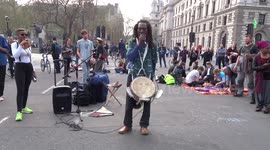 Extinction Rebellion in Parliament Square - African song prays for water as central London is standing still on day three of climate change protests