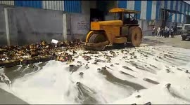 Indian authorities steam-roller more than 11,000 cans of expired beer