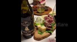 Traditional Albanian food served in bottle of wine