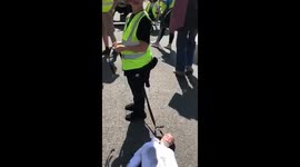 Yellow vests protesters use child to drag a dummie of Sadiq Khan.