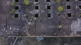 Aerial footage of abandoned building roof