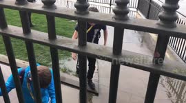 People in Greenwich get wet from the high tide
