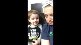 Toddler tries hard to show his mean face