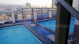 Swimming pools on tower block shake as earthquake hits the Philippines