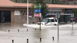 UK tourist spots cars wading through deep water as Spanish town flooded
