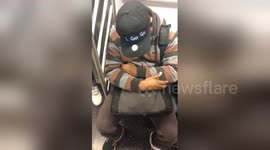 US man wears ingenious hat asking people to 'wake him up before 34th Street'