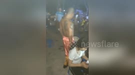 Vietnamese man uses iron hook on his neck to lift a 3kg cement pot