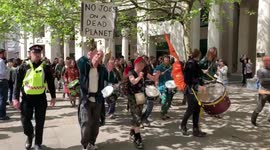 Protesters from Extinction Rebellion march past St Paul’s Cathedral in London