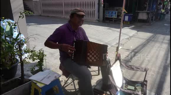 Street Musicians of Thailand - the man with the accordion