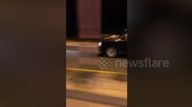 Elderly Thai man clings to pal's car bonnet after they had an argument