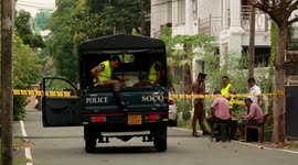 Police work outside expensive home of two of the Sri Lanka attackers