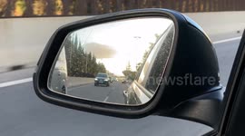 Looking in rear view wing mirror seeming card come up to over take you POV