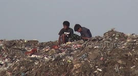Kids in Mumbai seen playing atop mountains of garbage