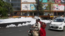 Polluted lake foams over street of south Indian city