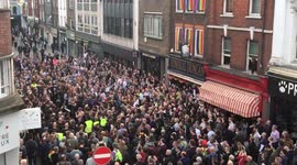 Homophobic nail-bomb attack remembered by defiant crowd-rousing street choir