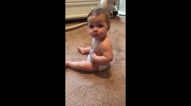 Funny baby pats tummy after a good meal