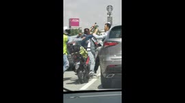 Malaysian drivers stop traffic to have road rage brawl at traffic lights