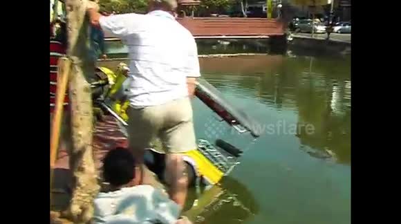 Tuk Tuk rescued from moat in Chiang Mai, Thailand