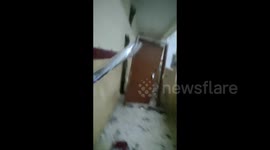 Waterlogged door bursts from frame during Cyclone Fani