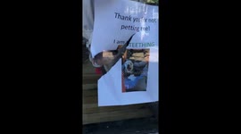 Dog eats sign asking people not to touch him.