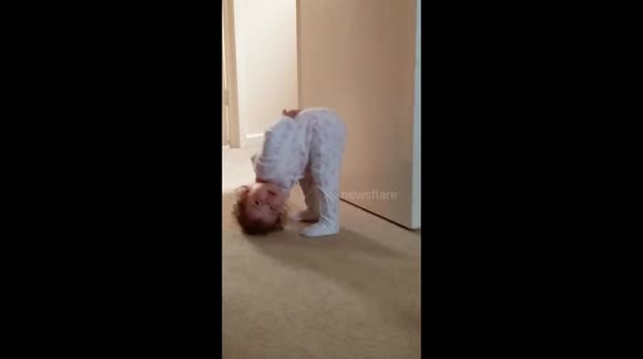 Toddler has funny way of standing while staring at her mummy