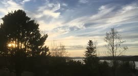 Amazing time-lapse captures Brilliant Sunset over a calm river