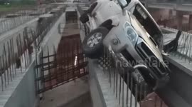 Bungling driver gets stuck after trying to cross half-finished motorway bridge
