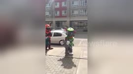 Mascot's head goes rolling after hugging young boy