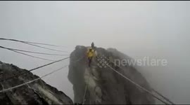 the struggle for eternal snow tops Cartenz Papua Indonesia