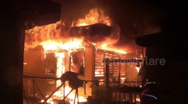 Firemen in Indonesia struggle to put out house in flames due to water pump failure