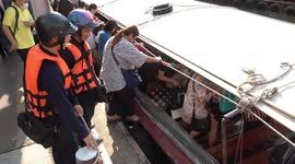Passengers leap onto canal boat in perilous commute that sees dozens fall into the water every year