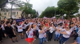 Thousands of people dance on the walking street in Hanoi.