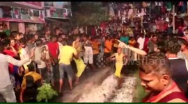 Hundreds of devotees walk barefoot over bed of hot embers in Indian festival