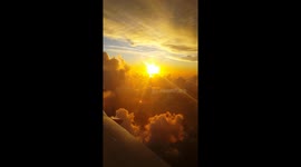 Wing Of The Plane With Amazing Cloudy Sunrise
