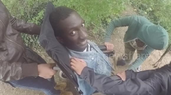 Adventurous teenage cousins hilariously take wheelchair user down a very steep slope