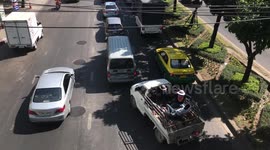 Passenger relaxes in hammock during traffic jam